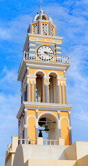 Wall Mural - Bell tower with clock of Catholic Cathedral Church of Saint John the Baptist in Fira on Santorini island, Cyclades, Greece