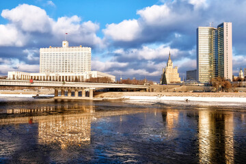 Wall Mural - winter moscow city russia architecture landmark skyline with russian government white house, moscow government office tower and stalin era skyscraper against blue sky with clouds background