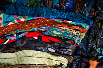 A bundle of colorful, oldfashioned business ties.