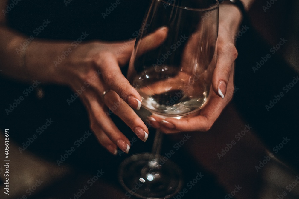 Cropped Hands Of Woman Holding Empty Wineglass - obrazy, fototapety, plakaty 