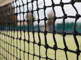 Tennis net with bokeh effect. Concept of strength, separation and ball games