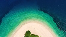 Drone Zooming In On Ag Dimitrios Alonissos Beach In Greece. The Camera Facing Down, Capturing The Beautiful Beach That Is Shaped Like An Arc. 1080p