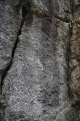 The texture of the rock. Mountain cliff of rock surface. Natural cave wall.