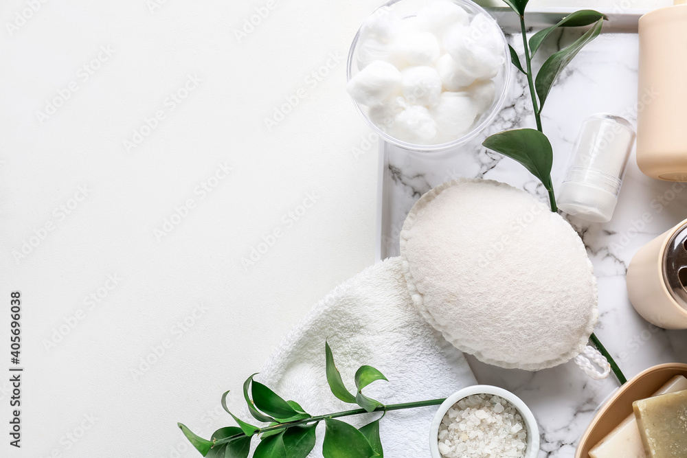 Bath accessories and cosmetics on light background
