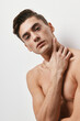 © SHOTPRIME STUDIO - Sexy brunette guy nude torso hand near face