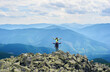 © anatoliy_gleb - Front view of happy couple posing, woman sitting on shoulders of man, beautiful mountains scenery on background. Tourists reaching peak together. Wild nature with amazing views. Sport tourism.