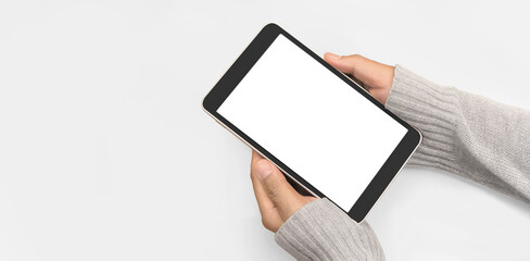 Hands holding  tablet touch computer gadget with isolated screen