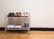 Small metal shoe shelf with women shoes