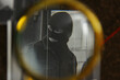 © New Africa - Looking at detective board through magnifying glass, closeup
