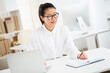 © chagin - Portrait of asian business woman at workplace in office