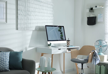 Poster - Comfortable office chair near desk with modern computer indoors