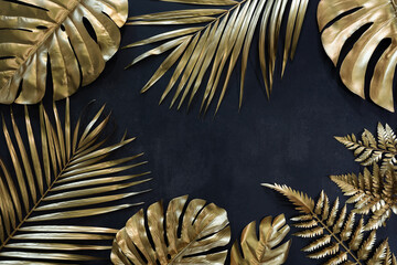 Wall Mural - Collection of tropical leaves in gold color on black space background.Abstract leaf decoration design.