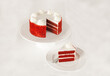 © Yell Design - Red velvet cake isolated on white with slice whipped cream ready to serve