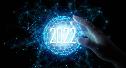 Wall Mural - 2022 technology. blue black ground. concept for technology vision in year 2022. hand touching circle