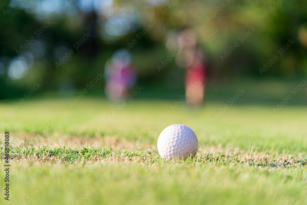 Close-up Of Golf Ball On Grass - obrazy, fototapety, plakaty 