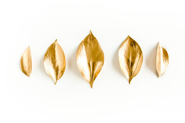 Wall Mural - Pattern, texture with gold leaves isolated on white background. flat lay, top view