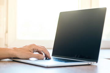 Wall Mural - close up. male using a modern laptop.