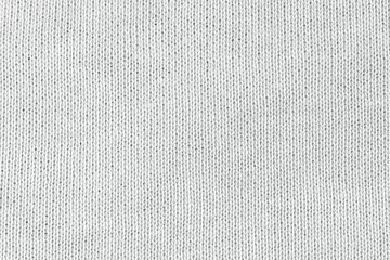 White natural texture of knitted wool textile material background. White cotton fabric woven canvas texture