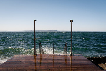 Wall Mural - wooden pier with sea background