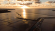Sunset in the salt pans of Marsala in Sicily seen from the drone