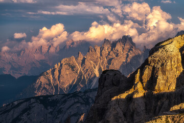 Poster - Impressive shot of rocky mountains in a daytime under the cloudy sky