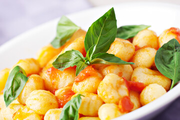 Poster - Homemade gnocchi with tomato sauce basil and cheese.