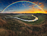 Fototapeta Tęcza - Amazing rainbow over the small rural river. autumn morning

