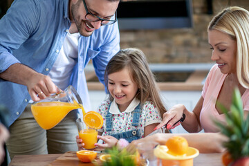 Poster - Family making juice in their kitchen