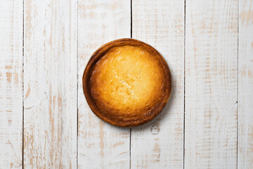 top view of a whole delicious homemade pie on a wooden tabl