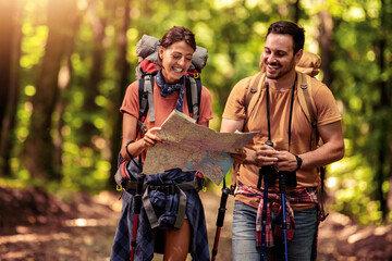happy couple hiking in forest