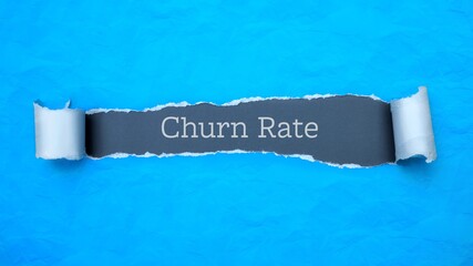 Wall Mural - Churn Rate. Blue torn paper banner with text label. Word in gray hole.