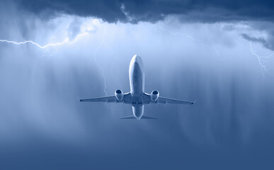 Airplane in the sky with thunder and lightning