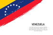 Grunge styled brush stroke background with flag of Venezuela