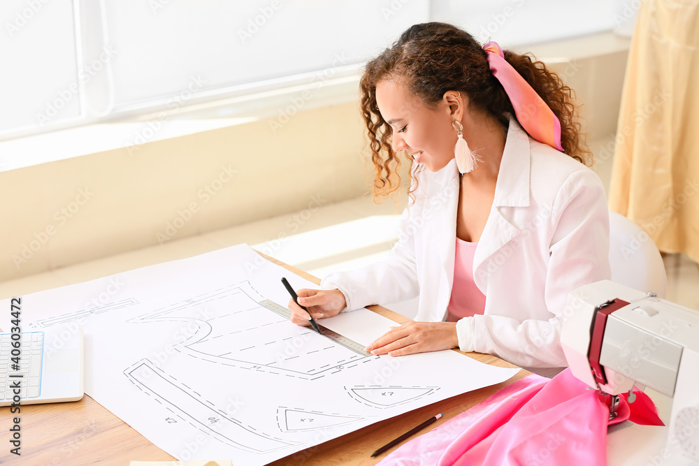 Female fashion designer working in studio