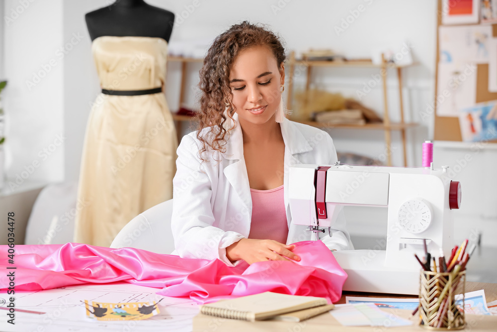 Female fashion designer working  in atelier