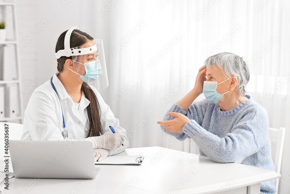 Senior woman visiting doctor in clinic