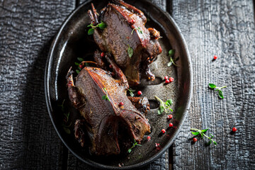 Wall Mural - Top view of two wild pigeons roasted with spices