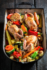 Wall Mural - Homemade grilled quails with vegetables in casserole