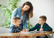 © Lumos sp - homework teaching education mother children son familiy childhood child teacher classroom