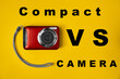© Anton Prokopenko - Compact camera on a yellow background. Travel digital camera VS