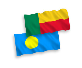 National vector fabric wave flags of Palau and Benin isolated on white background. 1 to 2 proportion.