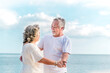 © lukyeee_nuttawut - Happy asian senior retired couple, relax smiling elder man and woman enjoying with retired vacation at sea beach outdoor. Health care, Family outdoor lifestyle