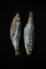 Traditional Dried Fish On A Black Background.