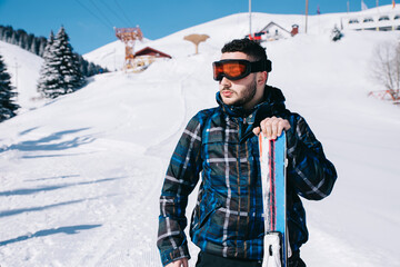 Skier Standing On The Skiing Slope	