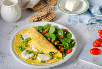 Wall Mural - Bio eggs omelet with salad