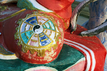 Close Up Detail Of A Colorful Ancient Red Yin And Yang Orb At A Chinese Buddhist Temple In Southeast Asia