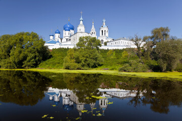 Sticker - View of the Holy Bogolyubsky orthodox convent on the high bank and its reflection in the Klyazma river. Bogolyubovo, Vladimir region, Russia