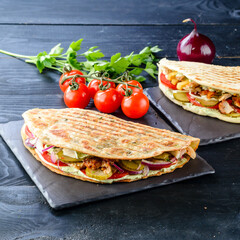 Sticker - Snack. Takeaway food, street fast food. Pita bread sandwich with fresh vegetables and meat. Kebab in flat cake