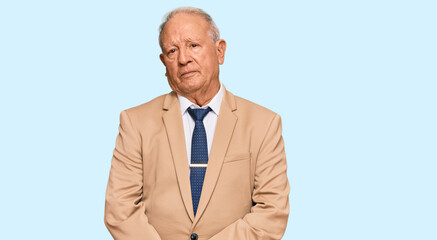 Sticker - Senior caucasian man wearing business suit and tie relaxed with serious expression on face. simple and natural looking at the camera.