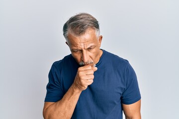 Sticker - Middle age grey-haired man wearing casual clothes feeling unwell and coughing as symptom for cold or bronchitis. health care concept.